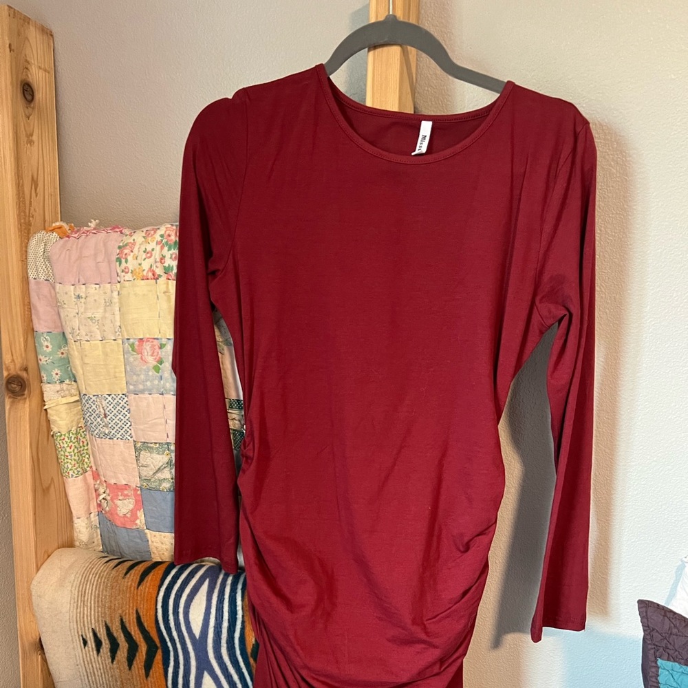 Mid length dress with 3/4 sleeves and gathered sides